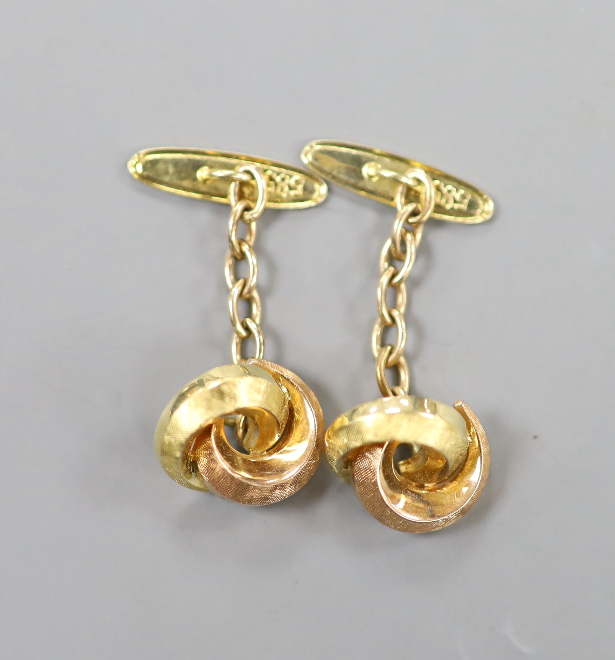 A modern pair of two colour yellow metal (stamped 585) knot cufflinks, 12mm, 4 grams.
